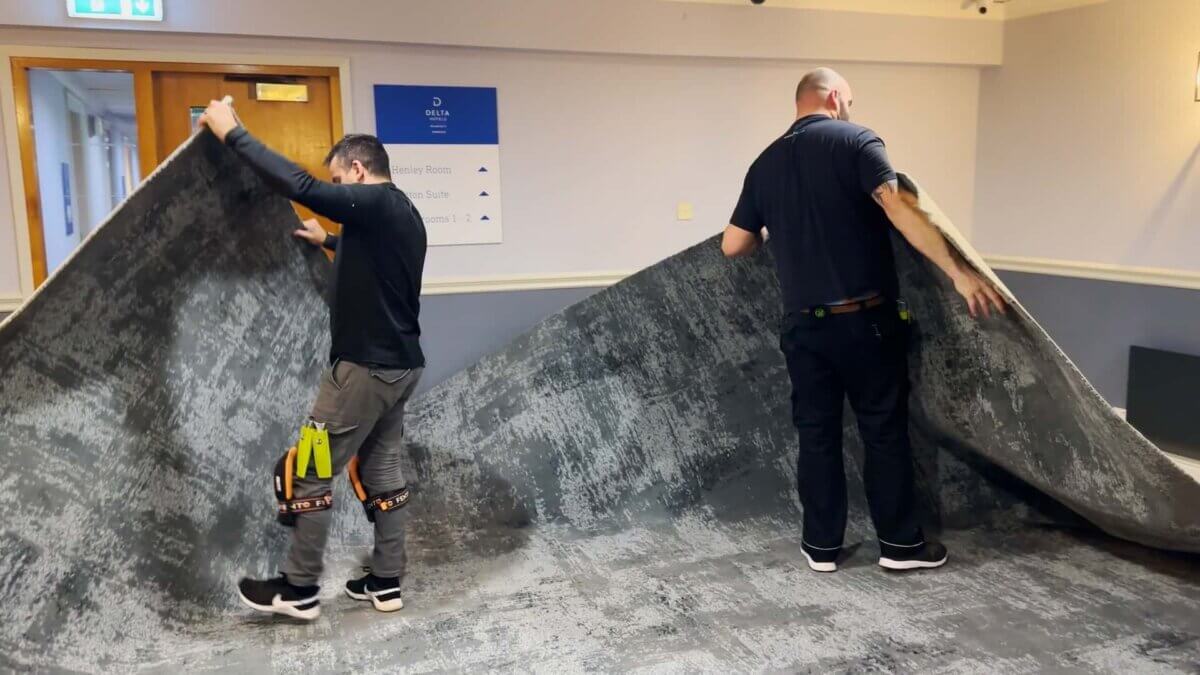Alex and Growbag laying carpet for Delta Hotel corridors