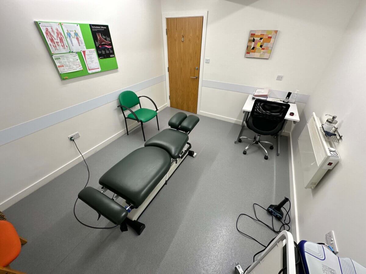 Clinic Room with chiropractor chair in middle of room