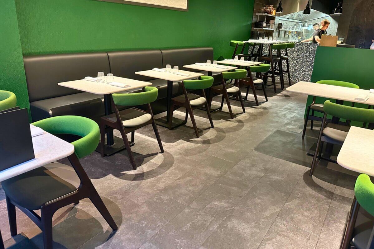 Interior shot of Land Restaurant, showcasing vinyl tiles