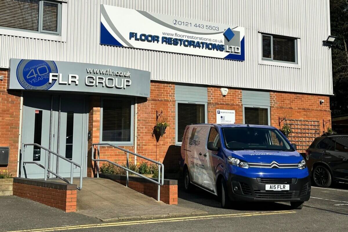 Outside photo of FLR Group van and offices showing signage