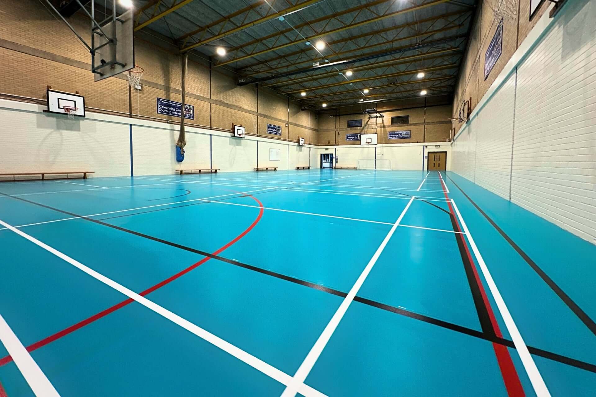 Low angle showcasing sports flooring in light blue