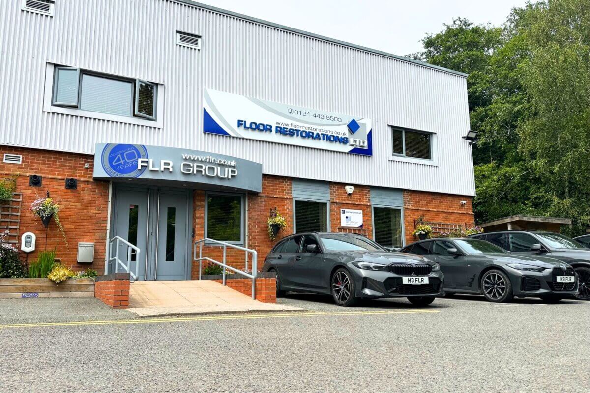 Exterior shot of company cars and entrance of flr group offices