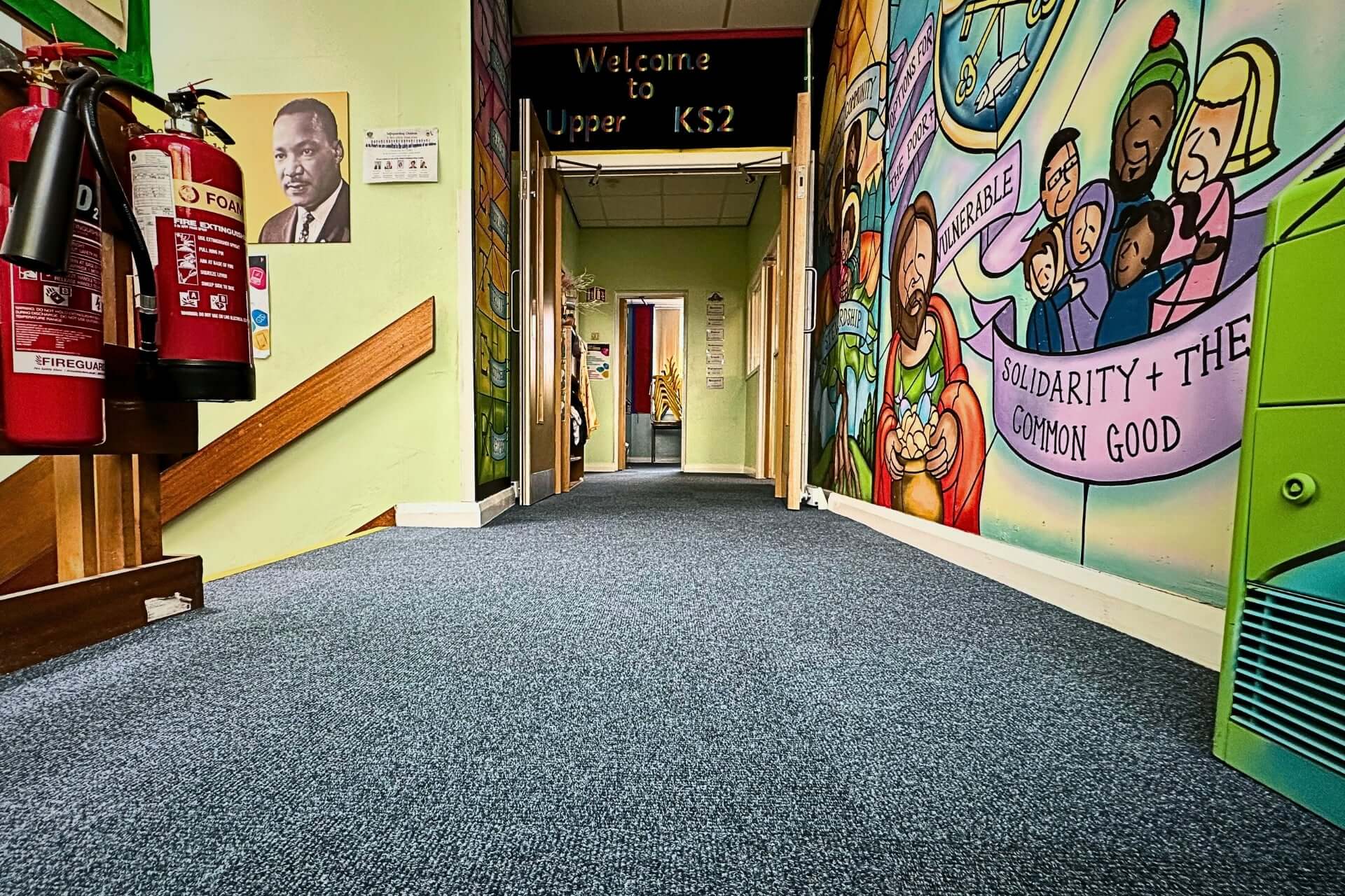 Interior shot of corridor at a Primary School showcasing blue carpet tiles