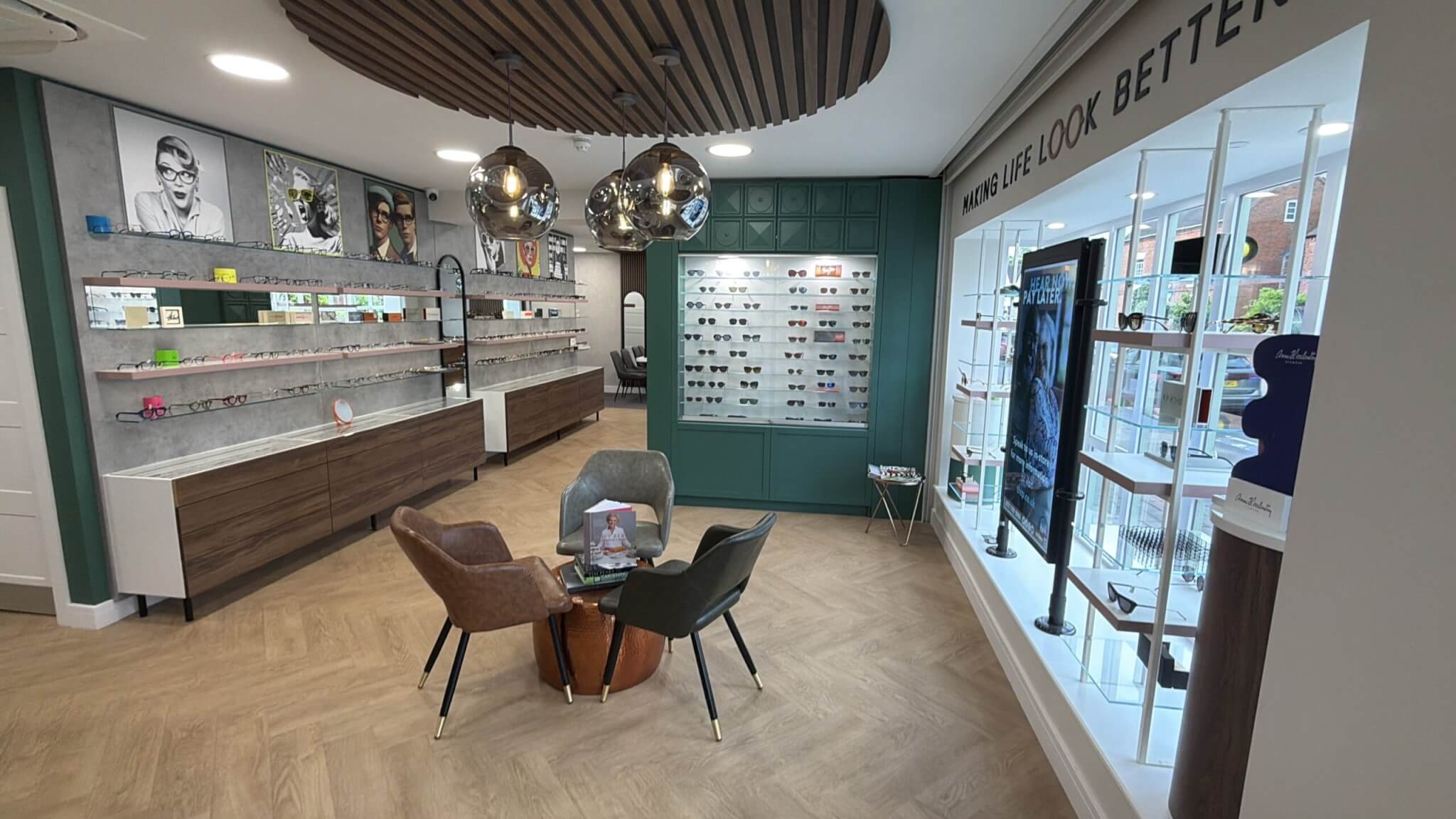 Perspective Opticians interior in Knowle with Plus Floor LVT herringbone flooring, eyewear displays, and a central seating area.